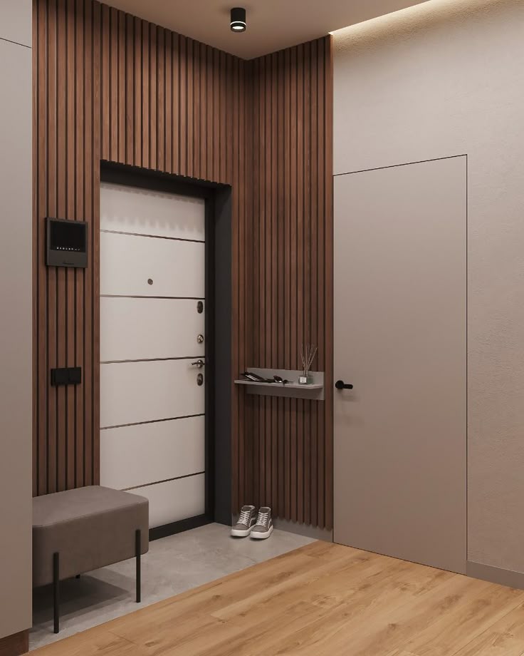 Прихожая с деревянными рейками, скрытой дверью и лаконичным пуфом