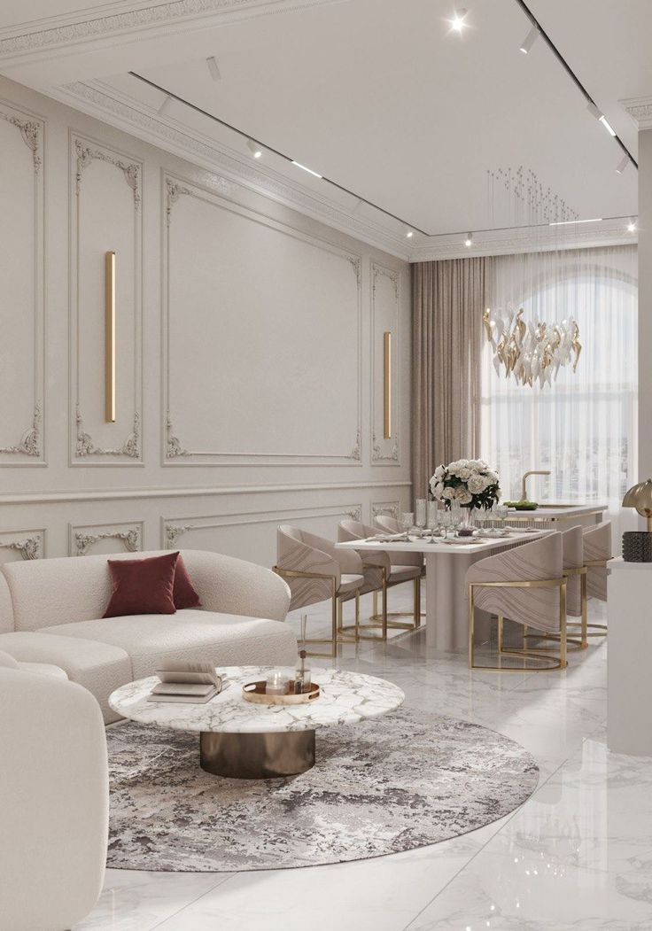 Кухня-гостиная в стиле неоклассика со светлой отделкой, мраморным полом и обеденной зоной
